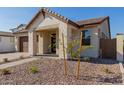 Modern home exterior with light-colored stone and landscaping at 21354 E Sparrow Dr, Queen Creek, AZ 85142
