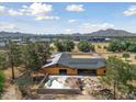 Aerial view of a new construction home and pool at 18526 E Cloud Rd, Queen Creek, AZ 85142