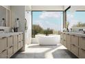 Spa-like bathroom with freestanding tub and dual vanities at 40575 N 109Th Pl, Scottsdale, AZ 85262