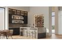 Elegant wet bar with wine storage and modern finishes at 40575 N 109Th Pl, Scottsdale, AZ 85262