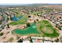 Wide aerial view of golf course and surrounding neighborhood at 523 N Rainbow Way, Casa Grande, AZ 85194