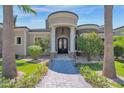 Elegant home entrance with stone and columns at 3749 E Juniper Cir, Mesa, AZ 85205