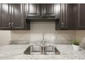 Modern kitchen sink with granite countertop at 7920 E Camelback Rd # 206, Scottsdale, AZ 85251