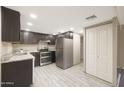 Modern kitchen with granite counters and stainless steel appliances at 7920 E Camelback Rd # 206, Scottsdale, AZ 85251