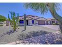 House exterior with gravel driveway and cactus plants at 35925 N 30Th Dr, Phoenix, AZ 85086