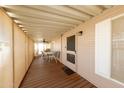 Covered patio with wooden deck and outdoor dining set at 11596 W Sierra Dawn Blvd # 36, Surprise, AZ 85378