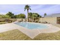 Relaxing rectangular pool surrounded by desert landscaping at 518 N Home Pl, Chandler, AZ 85224