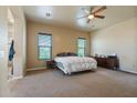 Large bedroom with ceiling fan and private access to bathroom at 32120 N 167Th Ave, Surprise, AZ 85387