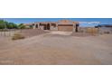 View of two-story home from across the yard at 32120 N 167Th Ave, Surprise, AZ 85387