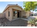 Single story home with a two car garage and desert landscaping at 36029 N Mirandesa Dr, San Tan Valley, AZ 85143