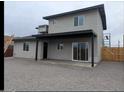 Back of house featuring covered patio and gray gravel yard at 6134 S Borego Rd, Gold Canyon, AZ 85118