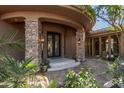 Elegant entryway with stone pillars and a double door at 15827 E Firerock Country Club Dr, Fountain Hills, AZ 85268