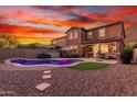 Stunning aerial view of a two-story home with a pool and landscaped backyard at 12687 W Caraveo Pl, Peoria, AZ 85383