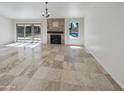 Spacious living area featuring tile flooring and a fireplace at 4801 E Nisbet Rd, Scottsdale, AZ 85254