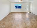 Large living room with tile flooring and lots of natural light at 5750 W Cortez St, Glendale, AZ 85304