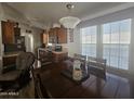 Kitchen with wooden cabinets and dining area at 8700 E University Dr # 339, Mesa, AZ 85207