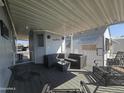 Covered patio with seating area, perfect for outdoor relaxation at 8700 E University Dr # 339, Mesa, AZ 85207