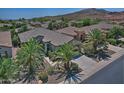 Aerial view of single-story home with desert landscaping at 13055 W Eagle Talon Trl, Peoria, AZ 85383