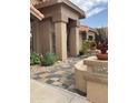 Attractive entryway with tile flooring and landscaping at 9510 W Menadota Dr, Peoria, AZ 85382