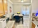 Dining area with table and chairs, near the kitchen at 5418 W Belleview St, Phoenix, AZ 85043