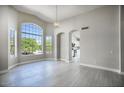 Bright dining room with large window and view of backyard at 3981 N 155Th Ave, Goodyear, AZ 85395