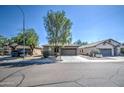 Three similar homes with attached garages and mature trees at 913 S 115Th Dr, Avondale, AZ 85323