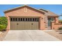 Lovely one-story home with a two-car garage and nicely landscaped yard at 26723 N 127Th Dr, Peoria, AZ 85383