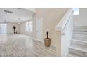 Bright entryway with stairs, wood-look flooring, and interior door at 13036 N 20Th St, Phoenix, AZ 85022