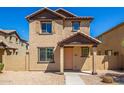 Two-story stucco home with a terracotta tile roof, shutters, and a welcoming front porch at 824 E Agua Fria Ln, Avondale, AZ 85323