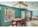 Small dining area with table and chairs, adjacent to living room at 36626 W Papago Dr, Stanfield, AZ 85172