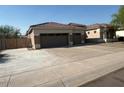 Two-story house with three car garage and gated entry at 2515 W Minton St, Phoenix, AZ 85041