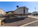 Mobile home with a fenced yard and satellite dish at 501 E Ray Rd # 211, Chandler, AZ 85225