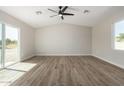 Bright bedroom with wood-look floors and large window at 14659 N Riverview Ct, Florence, AZ 85132