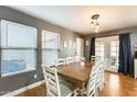 Charming dining room with a wooden table and access to the backyard at 18535 W Udall Dr, Surprise, AZ 85374