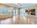 Open living room with hardwood floors and kitchen views at 26562 W Vista North Dr, Buckeye, AZ 85396