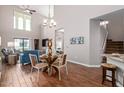 Bright dining area with glass table and four chairs at 2511 W Queen Creek Rd # 425, Chandler, AZ 85248