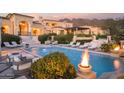 Luxury estate with a fire pit, pool, and stunning mountain views at 10947 E Wingspan Way, Scottsdale, AZ 85255