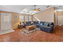 Comfortable living room with large sectional sofa and wood floors at 11596 W Sierra Dawn Blvd # 377, Surprise, AZ 85378