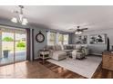 Spacious living room featuring a large sectional sofa and backyard access at 4882 E Amarillo Dr, San Tan Valley, AZ 85140