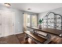 Bright dining area with wood table, bench, and decorative shelving at 4882 E Amarillo Dr, San Tan Valley, AZ 85140
