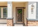 Inviting front door entrance with decorative security screen and wreath at 4882 E Amarillo Dr, San Tan Valley, AZ 85140