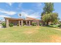 Single-story home with a landscaped yard, showcasing a welcoming exterior at 306 Leisure World --, Mesa, AZ 85206