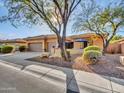 Two car garage and landscaped yard at 41910 N Emerald Lake Dr, Anthem, AZ 85086