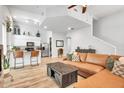 Open living room with L-shaped leather couch and kitchen views at 4216 N 27Th St # 106, Phoenix, AZ 85016