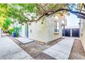 Side yard with concrete walkway and gravel landscaping at 4216 N 27Th St # 106, Phoenix, AZ 85016