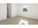Bright bedroom with neutral carpeting and large closet at 3530 E Alexander Dr, San Tan Valley, AZ 85143