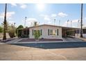 Tan single-story home with carport and nicely landscaped front yard at 303 S Recker Rd # 45, Mesa, AZ 85206