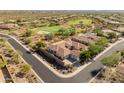 Aerial view of house and neighborhood, showing location near golf course at 41253 N Whistling Strait Ct, Anthem, AZ 85086