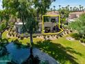 Aerial view of a two-story home near a lake at 8989 N Gainey Center Dr # 114, Scottsdale, AZ 85258