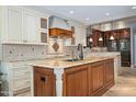 Gourmet kitchen with granite island and high-end appliances at 8989 N Gainey Center Dr # 114, Scottsdale, AZ 85258